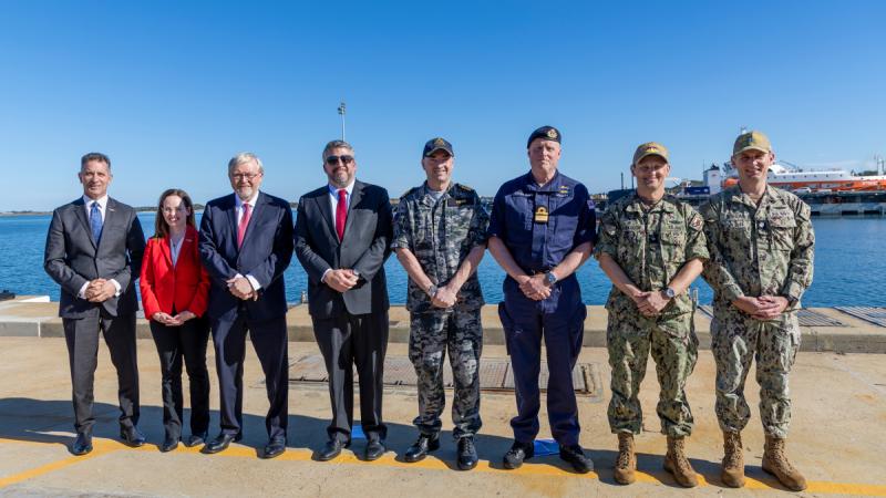 Representatives from Australia, United Kingdom, and United States, stand together after the arrival of United States Navy Virginia-class submarine USS North Carolina (SSN 777) at Fleet Base West in Rockingham, Western Australia.