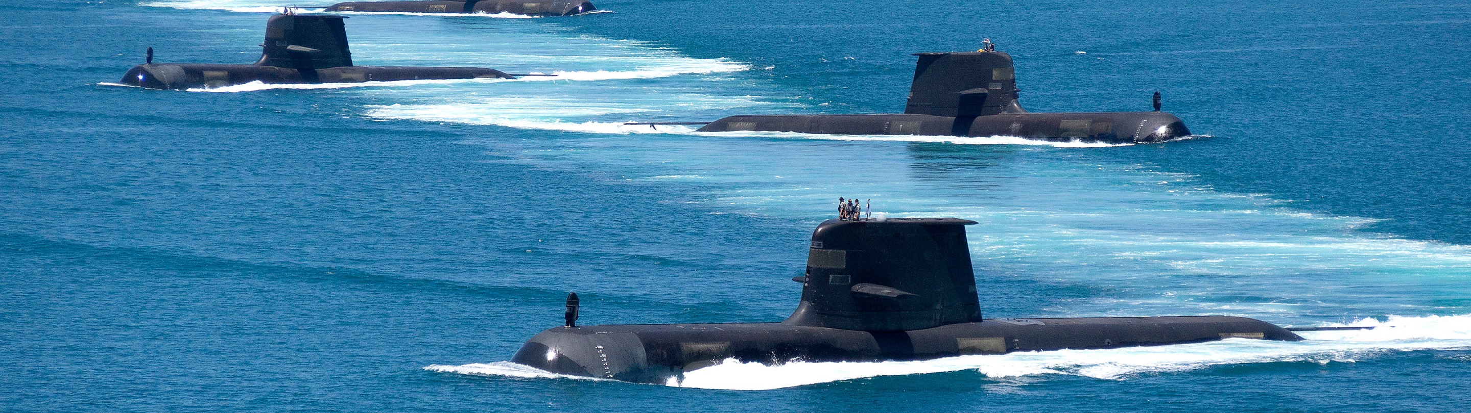 Three Submarines Floating in the ocean